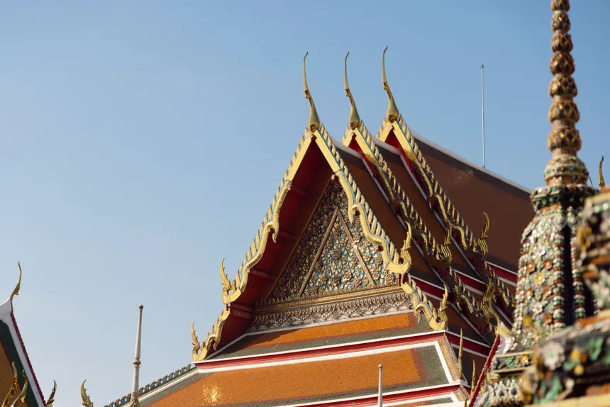 Close-up of ornate decorative roof at Wat Pho, a spiritual and popular tourist attraction in Thailand.